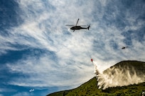 An Idaho Army National Guard UH-60M Black Hawk helicopter crew conducts water bucket training near Lucky Peak Reservoir May 20, 2026.