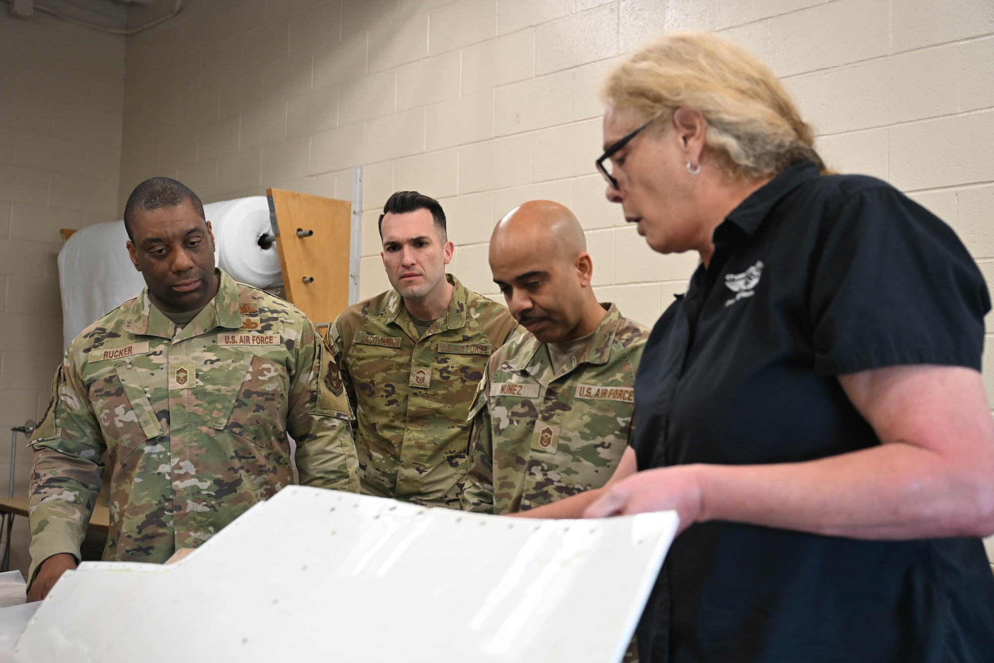 (From Right) Dawn Graham, department head at Connecticut Aero Tech School for Aviation Maintenance Technicians, Hartford, Connecticut, shows Kevlar material that students make for aircraft repairs to Chief Master Sgt. Israel Nuñez, senior enlisted advisor to the Chief of Air Force Reserve, the Pentagon, Arlington, Virginia, and the Command Chief Master Sgt. of Air Force Reserve Command, Robins Air Force Base, Georgia, Senior Master Sgt. Jared Locavara, recruiting flight chief at Westover Air Reserve Base, Massachusetts, and Chief Master Sgt. Armil Rucker, 350RCS senior enlisted leader, during a tour at CT Aerotech, May 7, 2026, Hartford, Connecticut. Nuñez teamed up with AFR recruiters from the 350th Recruiting Squadron, Joint Base McGuire-Dix-Lakehurst, New Jersey, to share the "Reserve Advantage" message that offers benefits, flexibility, and a life of service, with aircraft maintenance students at CT Aero Tech. (U.S. Air Force photo by Master Sgt. Della Creech)