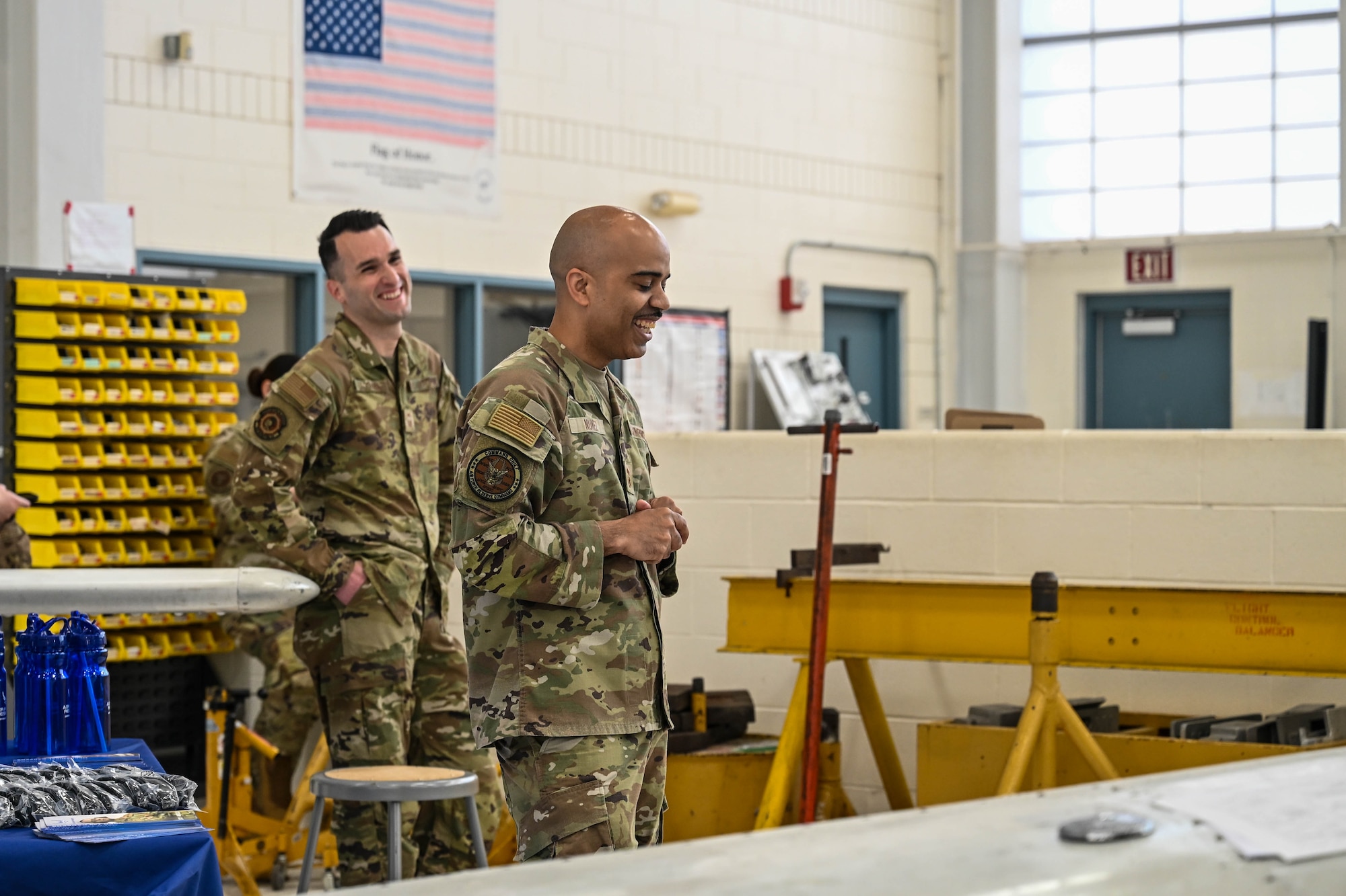 Senior Master Sgt. Jared Locavara, recruiting flight chief at Westover Air Reserve Base, Massachusetts, and Chief Master Sgt. Israel Nuñez, senior enlisted advisor to the Chief of AFR, the Pentagon, Arlington, Virginia, and the Command Chief Master Sgt. of Air Force Reserve Command, Robins Air Force Base, Georgia, jest with aircraft maintenance students at Connecticut Aero Tech School for Aviation Maintenance Technicians, Hartford, Connecticut, during an Air Force Reserve infosession May 7, 2026, Hartford, Connecticut. Nuñez teamed up with AFR recruiters from the 350th Recruiting Squadron, Joint Base McGuire-Dix-Lakehurst, New Jersey, to share the "Reserve Advantage" message that offers benefits, flexibility and a life of service, with aircraft maintenance students at CT Aero Tech. (U.S. Air Force photo by Master Sgt. Della Creech)