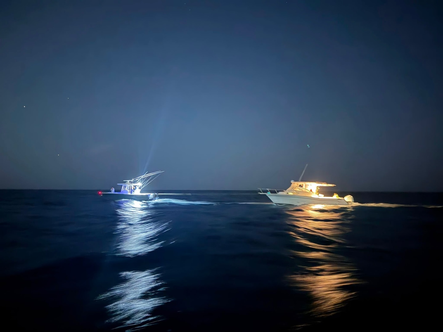A photo showing a Good Samaritan vessel towing a disabled vessel following a search and rescue case off Loiza, Puerto Rico, May 31, 2026.  A Coast Guard boat crew, with the assistance of a Coast Guard MH-60T Jayhawk aircrew, rescued one of three boaters from the water. The Coast Guard boat crew transported the survivor and escorted the Good Samaritan and the disabled vessel with the two other boaters to safe harbor in Piñones, Puerto Rico.  (US Coast Guard photo)