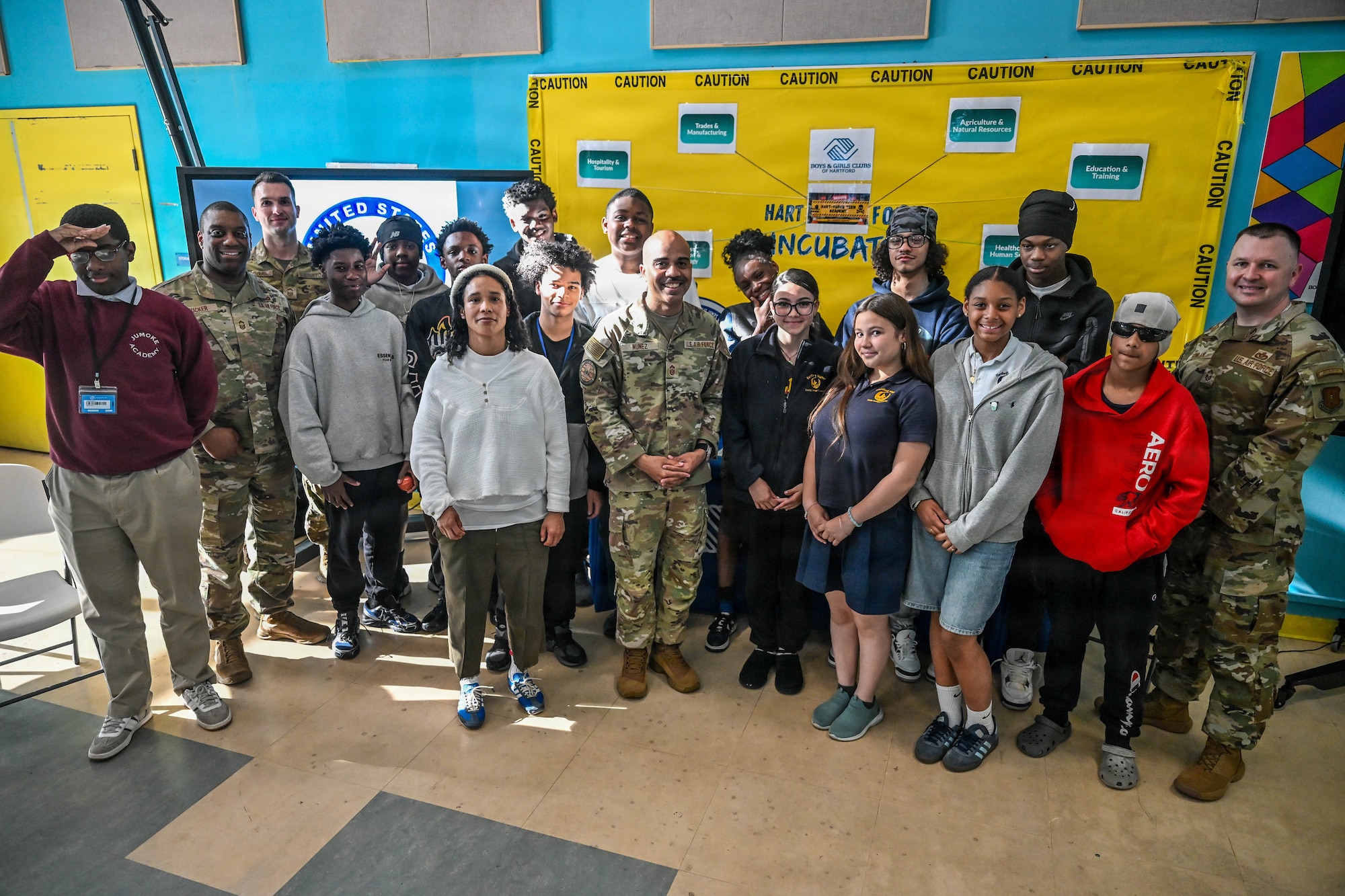 U.S. Air Force Chief Master Sgt. Israel Nuñez, senior enlisted advisor to the Chief of Air Force Reserve, the Pentagon, Arlington, Virginia, and the Command Chief Master Sgt. of Air Force Reserve Command, Robins Air Force Base, Georgia, poses with AFR recruiters from the 350th Recruiting Squadron, Joint Base McGuire-Dix-Lakehurst, New Jersey, and teens from the Boys and Girls Club community at Samuel S. Gray, Jr. Boys & Girls Club at Asylum Hill, May 7, 2026, Hartford, Connecticut. Nuñez teamed up with Senior Master Sgt. Jared Lacovara, recruiting flight chief at Westover Air Reserve Base, Massachusetts, Chief Master Sgt. Aaron Fowler, 350RCS accessions superintendent, and Chief Master Sgt. Armil Rucker, 350RCS senior enlisted leader, to share the "Reserve Advantage" message that offers benefits, flexibility, and a life of service with the Boys and Girls Club community and Catalina Pagan, life & workforce readiness director at Samuel S. Gray, Jr. Boys & Girls Club at Asylum Hill. (U.S. Air Force photo by Master Sgt. Della Creech)