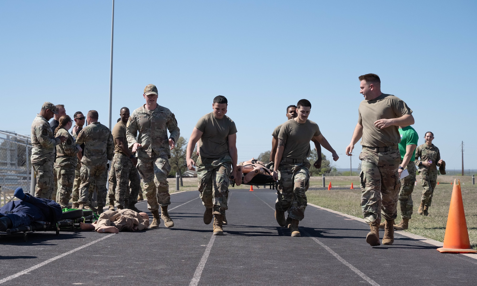 U.S. Air Force Airmen assigned to the 47th Communications Squadron races towards the finish line during the Tactical Combat Casualty Care (TCCC) Rodeo at Laughlin Air Force Base, Texas, March 20, 2026. The TCCC Rodeo was hosted by the Laughlin Warrior Action Team to promote fitness and combat readiness (U.S. Air Force photo by Airman 1st Class Darryl Keith)