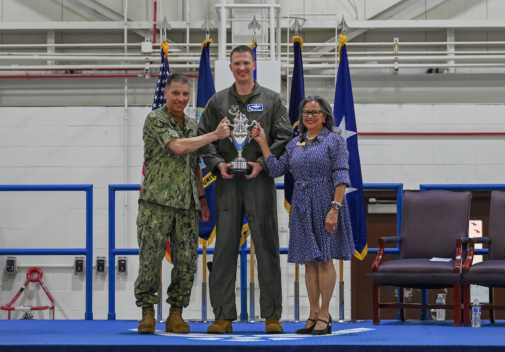 From left, U.S. Navy Adm. Richard Correll, commander, U.S. Strategic Command, U.S. Air Force Col. Joshua Wiitala, 509th Bomb Wing commander, and U.S. Sen. Rita Sanders, R-NE, hold the 2025 Omaha Trophy at Whiteman Air Force Base, Missouri, May 26, 2026.