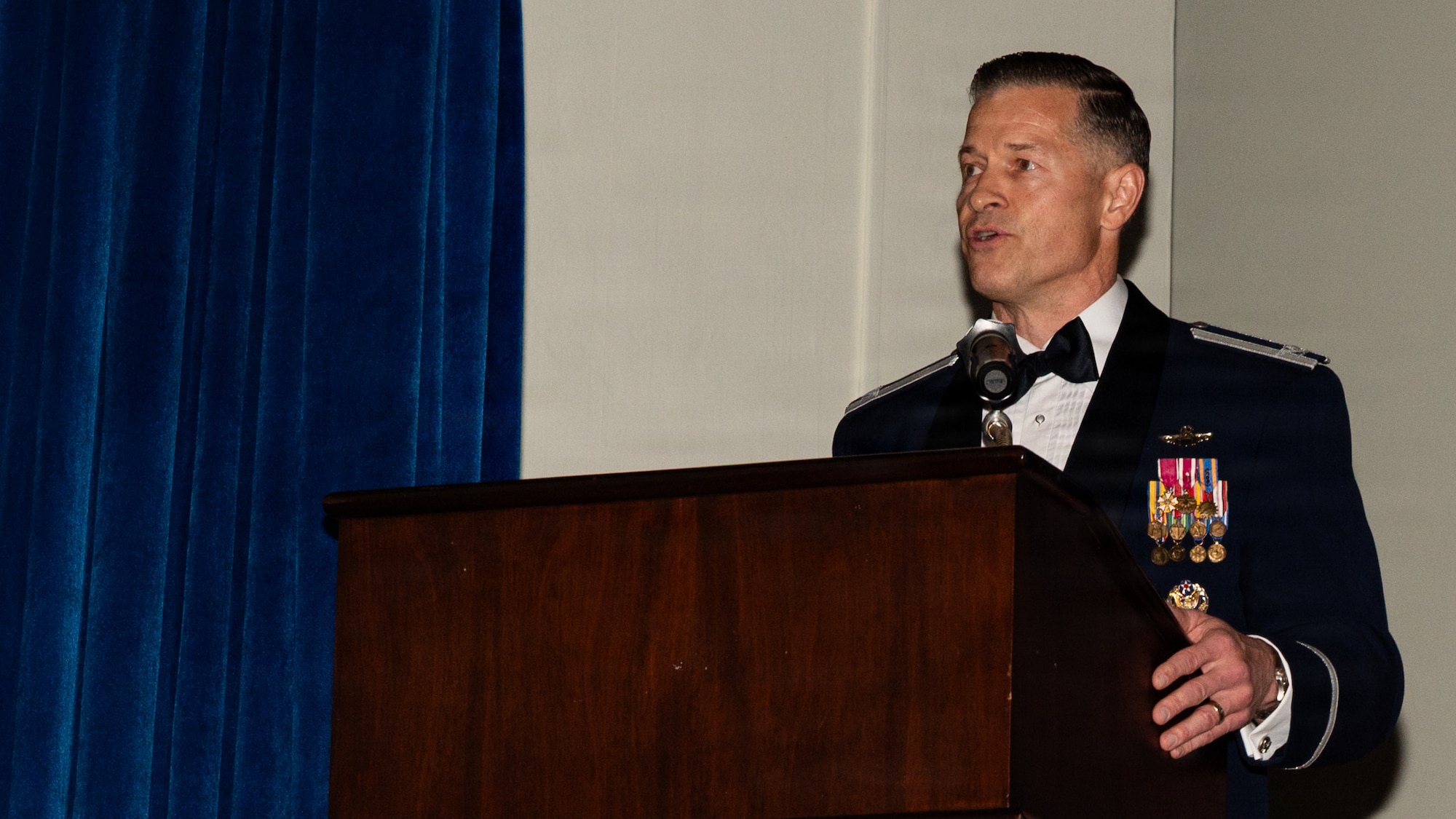 A person behind a podium speaking.