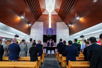 Maj. John F. Reutemann, deputy wing chaplain for the 51st Fighter Wing, leads a religious service during an interment ceremony for former French Korean War veterans André Datcharry and Jacques Grisolet at the United Nations Memorial Cemetery in Busan, South Korea, on May 27, 2026.