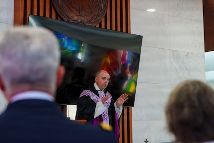 Maj. John F. Reutemann, deputy wing chaplain for the 51st Fighter Wing, leads a religious service during an interment ceremony for former French Korean War veterans André Datcharry and Jacques Grisolet at the United Nations Memorial Cemetery in Busan, South Korea, on May 27, 2026.