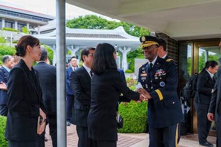 U.S. Army Gen. Xavier T. Brunson, commander of United Nations Command, Combined Forces Command, and U.S. Forces Korea, greets staff members at the United Nations Memorial Cemetery Korea before an interment ceremony for former French Korean War veterans André Datcharry and Jacques Grisolet in Busan, South Korea, on May 27, 2026.