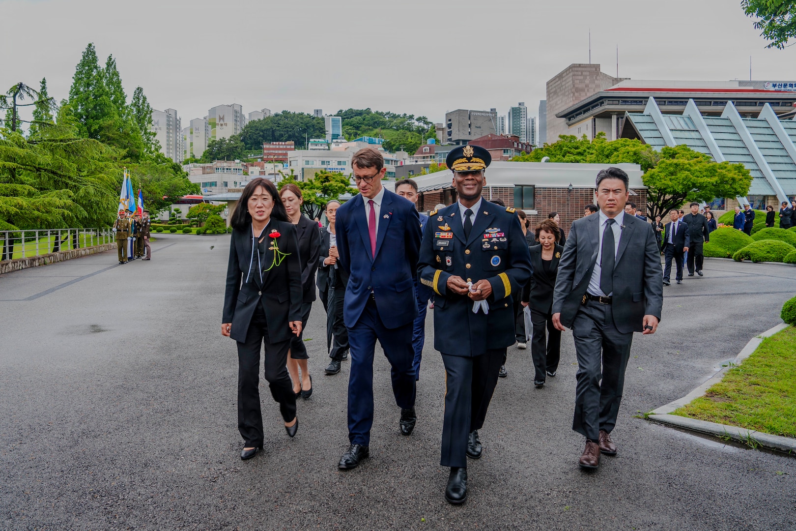 U.S. Army Gen. Xavier T. Brunson, commander of United Nations Command, Combined Forces Command, and U.S. Forces Korea, walks into the United Nations Memorial Cemetery in Korea with other attendees to participate in an interment ceremony for former French Korean War veterans André Datcharry and Jacques Grisolet in Busan, South Korea, on May 27, 2026. The event honors France’s sacrifices during the Korean War and recognizes its continued support to the United Nations Command.
