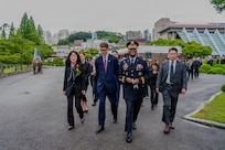 U.S. Army Gen. Xavier T. Brunson, commander of United Nations Command, Combined Forces Command, and U.S. Forces Korea, walks into the United Nations Memorial Cemetery in Korea with other attendees to participate in an interment ceremony for former French Korean War veterans André Datcharry and Jacques Grisolet in Busan, South Korea, on May 27, 2026. The event honors France’s sacrifices during the Korean War and recognizes its continued support to the United Nations Command.