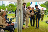Staff at the United Nations Memorial Cemetery Korea deliver the remains of French Korean War veteran André Datcharry to his family during an interment ceremony honoring Datcharry and Jacques Grisolet in Busan, South Korea, on May 27, 2026.