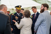 U.S. Army Gen. Xavier T. Brunson, commander of United Nations Command, Combined Forces Command, and U.S. Forces Korea, greets the family of French Korean War veteran André Datcharry after an interment ceremony for Datcharry and fellow veteran Jacques Grisolet at the United Nations Memorial Cemetery Korea in Busan, South Korea, on May 27, 2026.