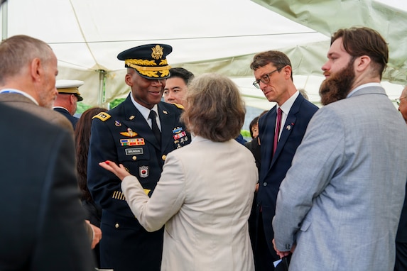 U.S. Army Gen. Xavier T. Brunson, commander of United Nations Command, Combined Forces Command, and U.S. Forces Korea, greets the family of French Korean War veteran André Datcharry after an interment ceremony for Datcharry and fellow veteran Jacques Grisolet at the United Nations Memorial Cemetery Korea in Busan, South Korea, on May 27, 2026.