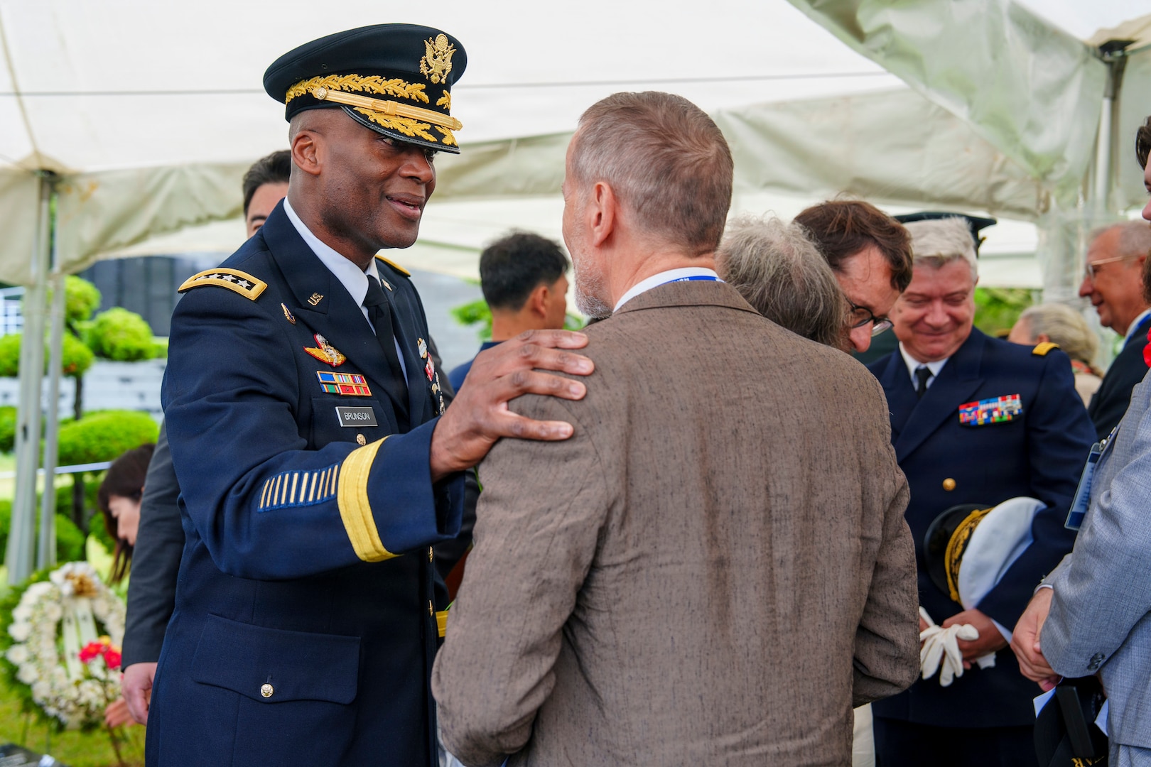 U.S. Army Gen. Xavier T. Brunson, commander of United Nations Command, Republic of Korea/U.S. Combined Forces Command, and U.S. Forces Korea, greets the family of French Korean War veteran Jacques Grisolet following an interment ceremony for Grisolet and fellow veteran André Datcharry at the United Nations Memorial Cemetery Korea in Busan, South Korea, on May 27, 2026.
