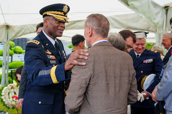 U.S. Army Gen. Xavier T. Brunson, commander of United Nations Command, Republic of Korea/U.S. Combined Forces Command, and U.S. Forces Korea, greets the family of French Korean War veteran Jacques Grisolet following an interment ceremony for Grisolet and fellow veteran André Datcharry at the United Nations Memorial Cemetery Korea in Busan, South Korea, on May 27, 2026.