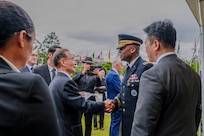 U.S. Army Gen. Xavier T. Brunson, commander of United Nations Command, Combined Forces Command, and U.S. Forces Korea, greets Sun Jeong‑in, custodian of the United Nations Memorial Cemetery Korea, after an interment ceremony for former French Korean War veterans André Datcharry and Jacques Grisolet in Busan, South Korea, on May 27, 2026.