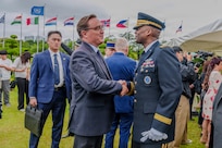 U.S. Army Gen. Xavier T. Brunson, commander of United Nations Command, Combined Forces Command, and U.S. Forces Korea, greets John Bocksay, director of internal affairs for the United Nations Memorial Cemetery Korea, following an interment ceremony for former French Korean War veterans André Datcharry and Jacques Grisolet in Busan, South Korea, on May 27, 2026.