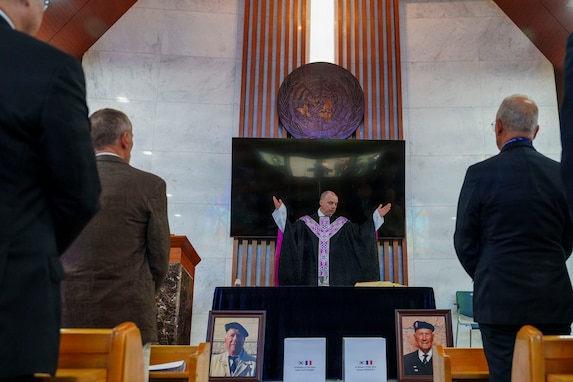 Maj. John F. Reutemann, deputy wing chaplain for the 51st Fighter Wing, leads a religious service at the United Nations Memorial Cemetery for French Korean War veterans André Datcharry and Jacques Grisolet in Busan, South Korea, on May 27, 2026.
