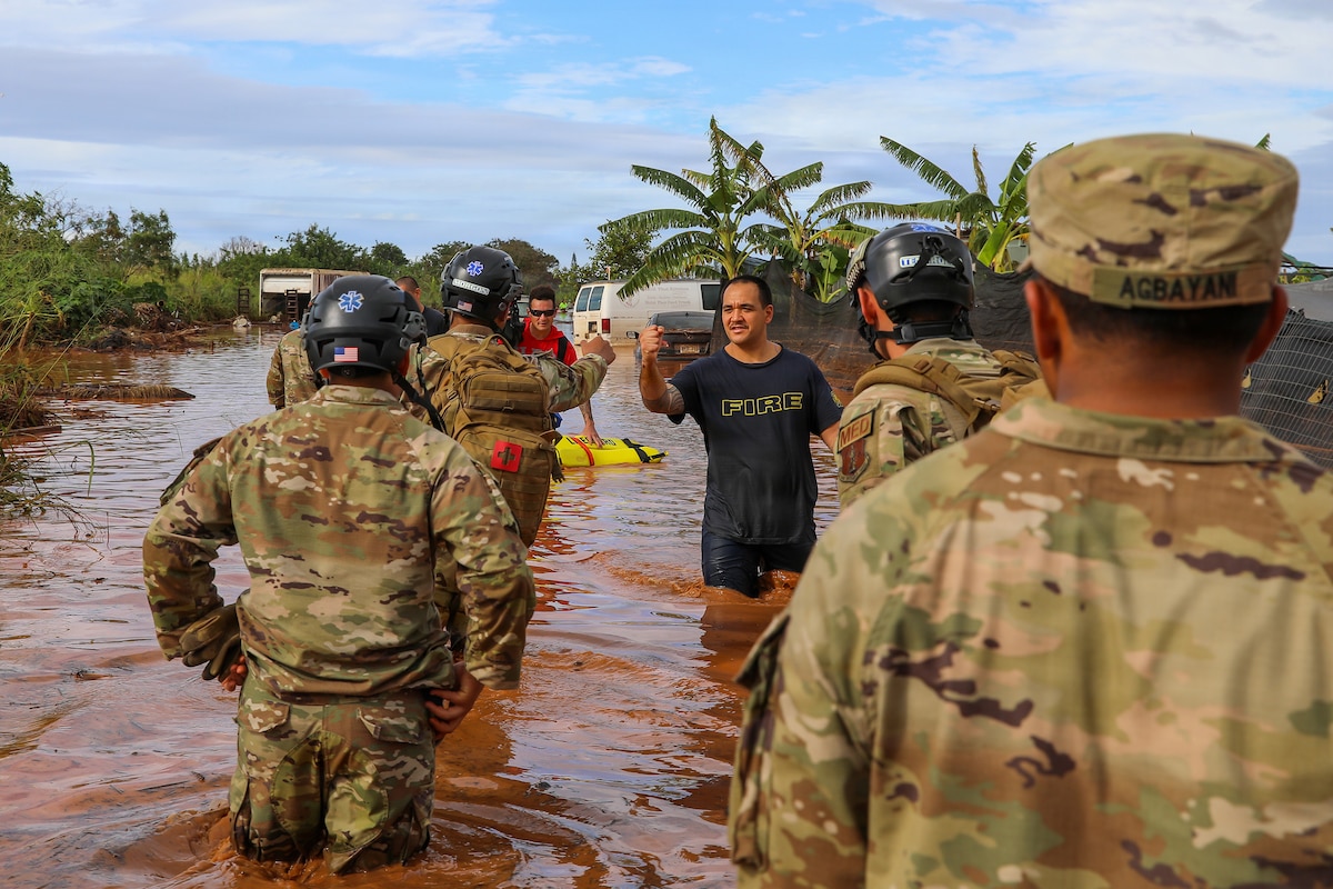 U.S. Soldiers assigned to the Hawaiʻi National Guard Chemical, Biological, Radiological, Nuclear and Explosives Enhanced Response Force Package assist the city and county of Honolulu first responders in search and recovery efforts during flood impacted zones in Waialua, Hawaiʻi, March 21, 2026.