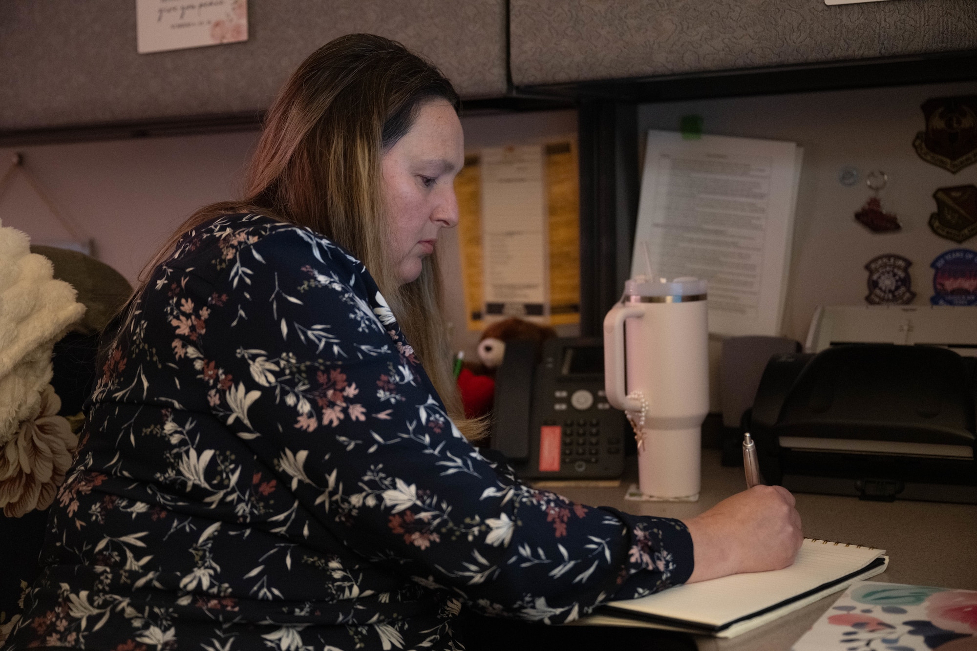 Stacie Bowlin, Laughlin Operational Medical Readiness Squadron family advocacy program assistant, writes down notes at Laughlin Air Force Base, Texas, June 1, 2026. Bowlin assists Airmen and civilians in effectively coping with their mental stressors to maintain their resiliency. (U.S. Air Force photo by Airman 1st Class Darryl Keith)