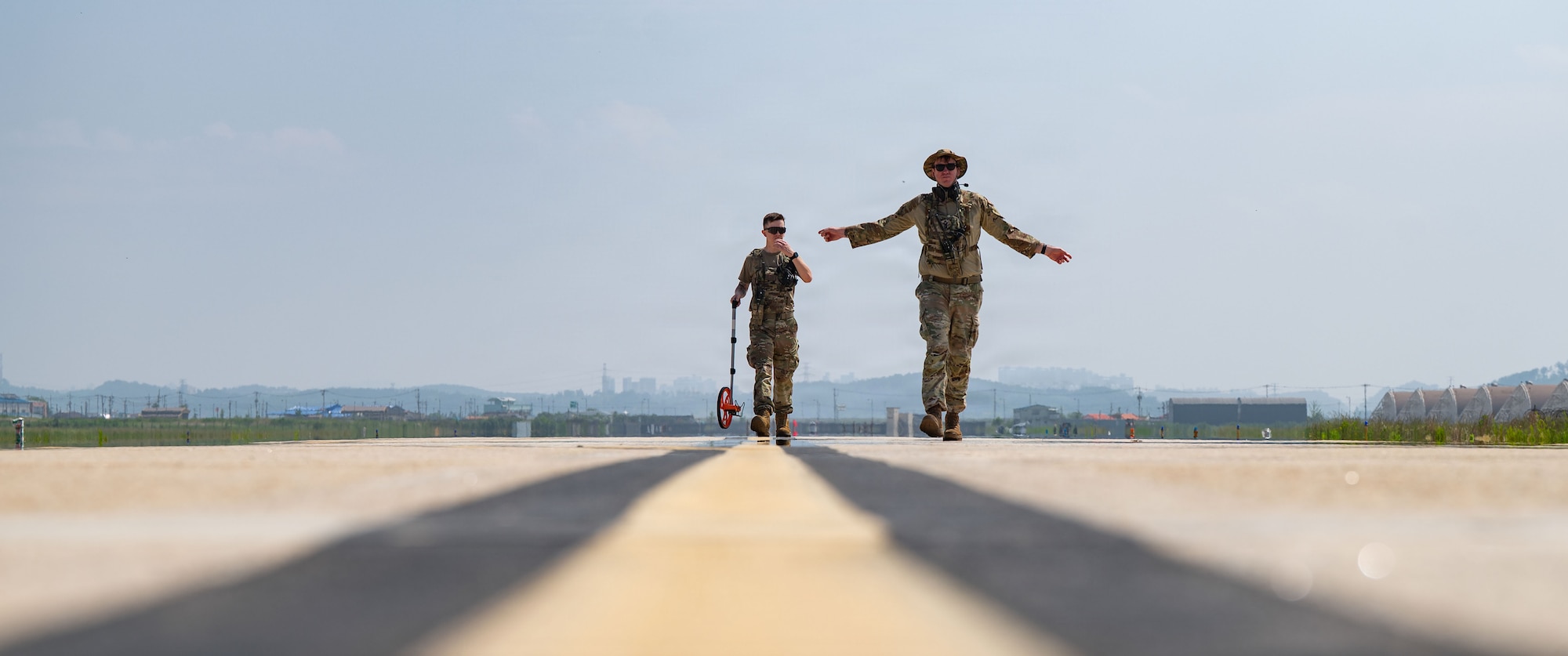 Airmen measure landing zone.