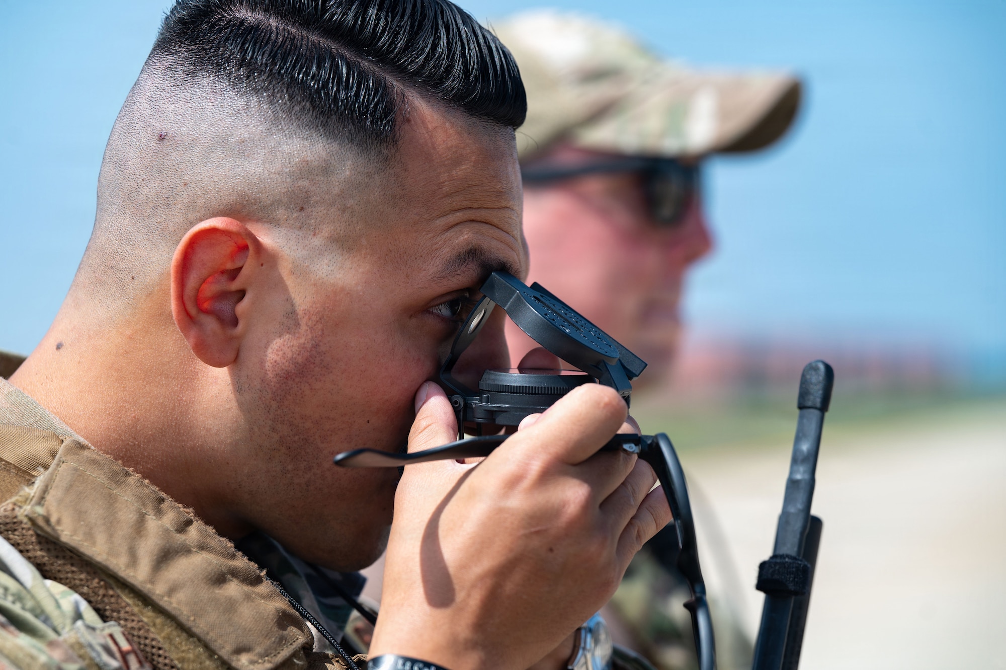 Airman uses compass.
