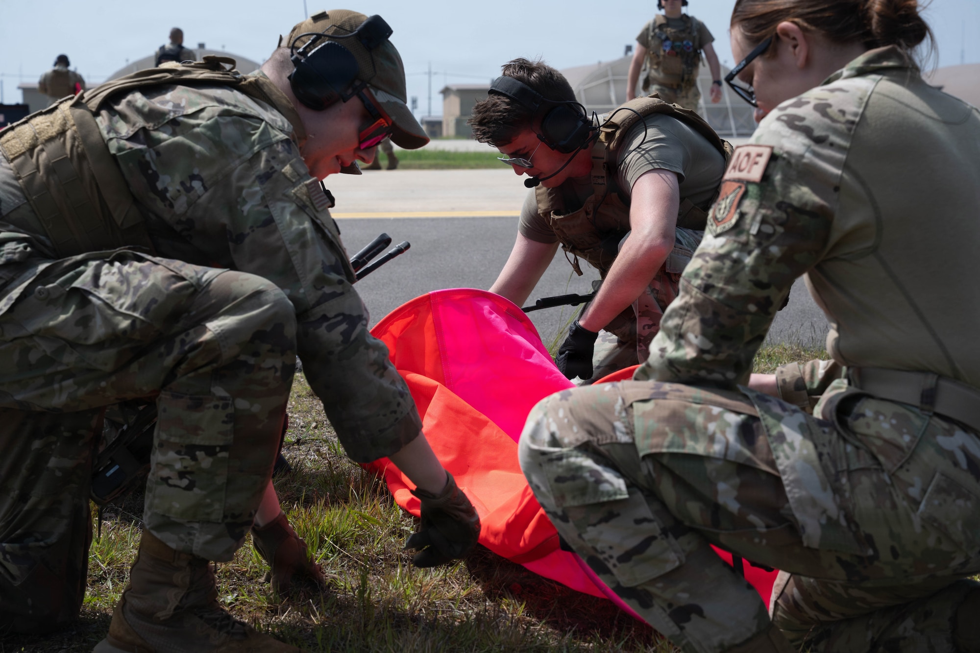 Airmen set up marking panels.