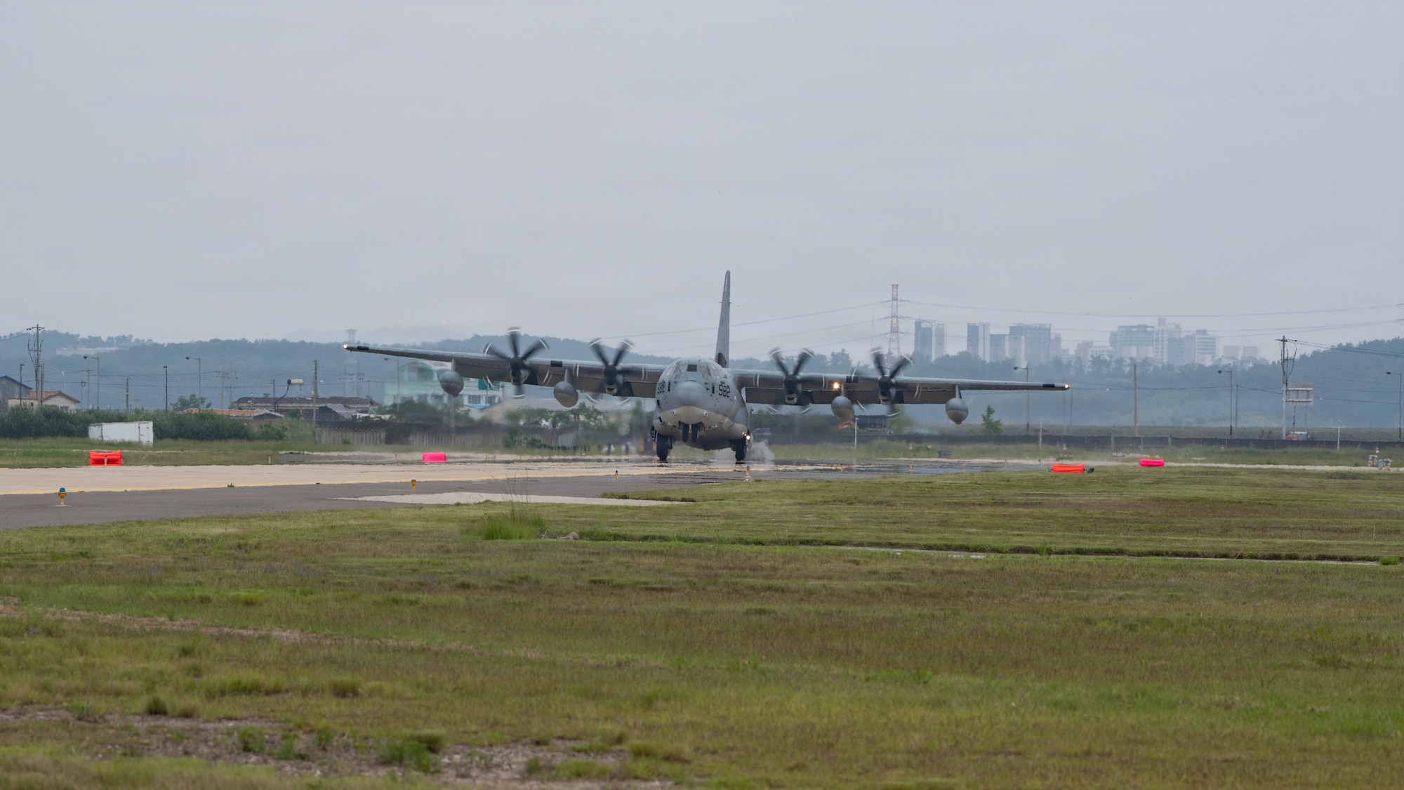 An aircraft lands on a runway.