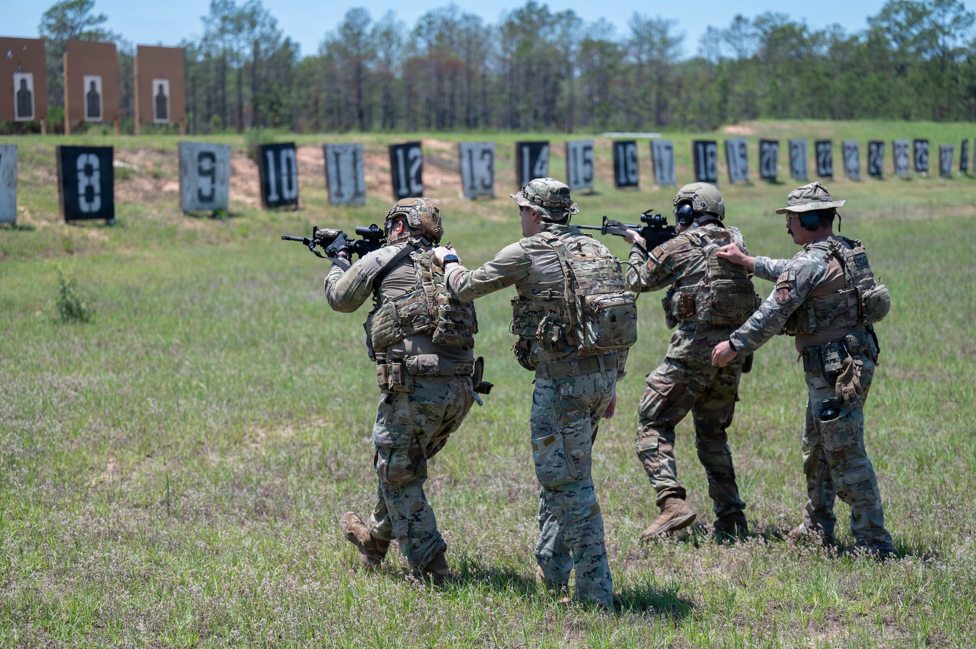 Airmen shoot at the range.