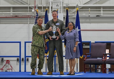 From left, U.S. Navy Adm. Richard Correll, commander, U.S. Strategic Command, U.S. Air Force Col. Joshua Wiitala, 509th Bomb Wing commander, and U.S. Sen. Rita Sanders, R-NE, hold the 2025 Omaha Trophy at Whiteman Air Force Base, Missouri, May 26, 2026.