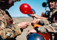 The balloons were attached to a controlled drone and ground targets to simulate counter-small unmanned aircraft systems engagements. (U.S. Air Force photo by Staff Sgt. Michael A. Richmond)
