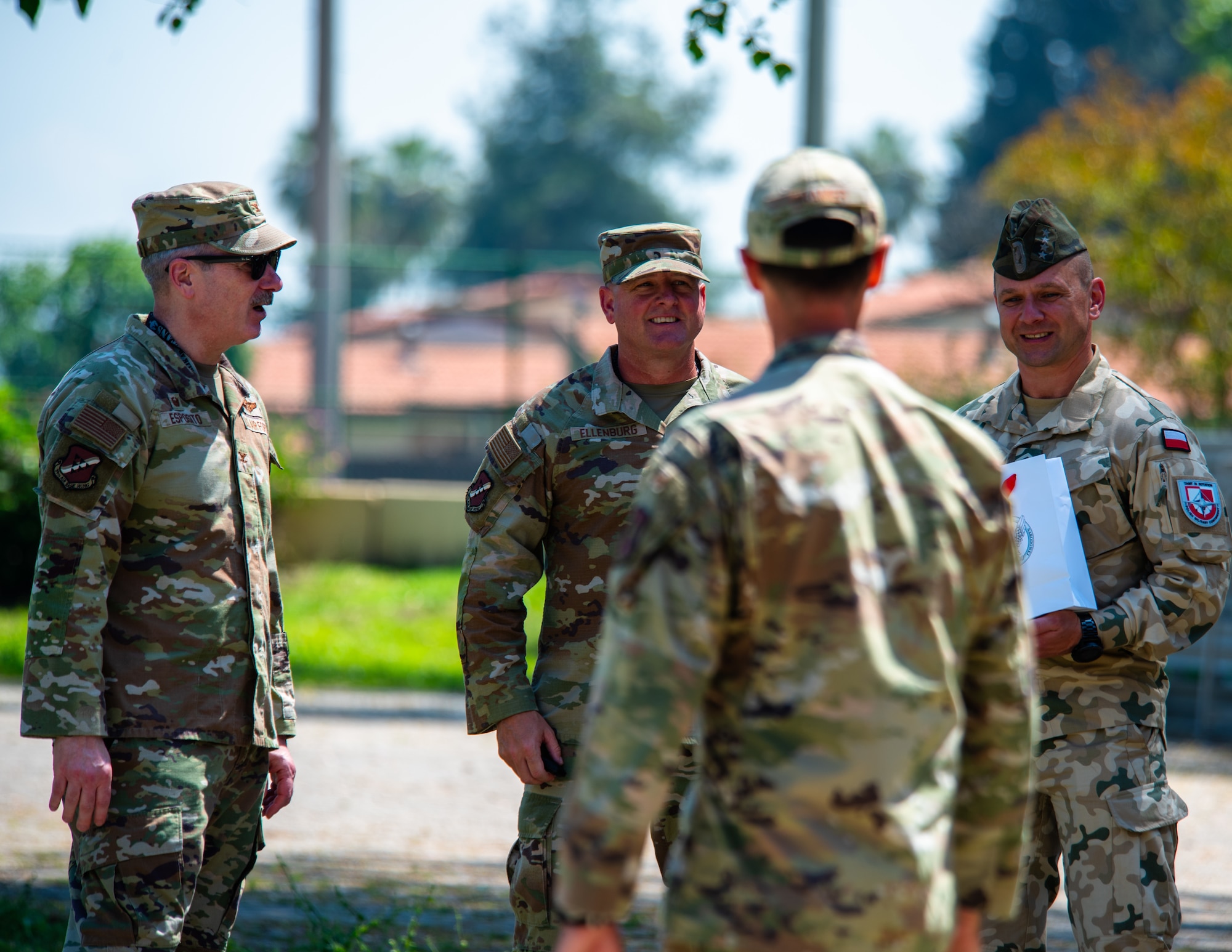 U.S. military members speak wit Polish military members