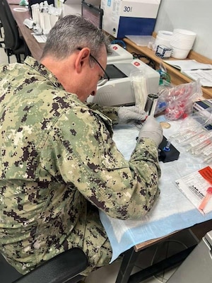 AGADIR, Morocco (April 29, 2026) Cmdr. Benjamin Espinosa, Naval Medical Research Unit (NAMRU) EURAFCENT science director, performs tests on sick call samples during exercise African Lion. NAMRU EURAFCENT, part of Navy Medicine Research & Development, conducts research, surveillance and studies of vaccines, therapeutic agents, diagnostic assays and vector control measures in the EUCOM, AFRICOM and CENTCOM Areas of Responsibility to better prevent and treat infectious diseases in support of Navy, Marine Corps and joint U.S. warfighter health, readiness and lethality.  (Courtesy photo by Maj. Paul Lenhart /Released)