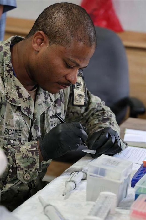 AGADIR, Morocco (April 28, 2026) Hospital Corpsman 1st Class Michael Scaife, Naval Medical Research Unit (NAMRU) EURAFCENT lab technician, processes clinical specimens for biosurveillance testing during exercise African Lion. NAMRU EURAFCENT, part of Navy Medicine Research & Development, conducts research, surveillance and studies of vaccines, therapeutic agents, diagnostic assays and vector control measures in the EUCOM, AFRICOM and CENTCOM Areas of Responsibility to better prevent and treat infectious diseases in support of Navy, Marine Corps and joint U.S. warfighter health, readiness and lethality.  (Courtesy photo by Maj. Paul Lenhart /Released)