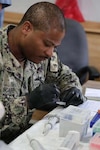 AGADIR, Morocco (April 28, 2026) Hospital Corpsman 1st Class Michael Scaife, Naval Medical Research Unit (NAMRU) EURAFCENT lab technician, processes clinical specimens for biosurveillance testing during exercise African Lion. NAMRU EURAFCENT, part of Navy Medicine Research & Development, conducts research, surveillance and studies of vaccines, therapeutic agents, diagnostic assays and vector control measures in the EUCOM, AFRICOM and CENTCOM Areas of Responsibility to better prevent and treat infectious diseases in support of Navy, Marine Corps and joint U.S. warfighter health, readiness and lethality.  (Courtesy photo by Maj. Paul Lenhart /Released)