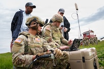 Indiana National Guard Soldiers with the 76th Mobile Brigade Combat Team and instructors operate a laptop connected to the Switchblade 600, a loitering munition system, during training at Camp Atterbury, near Edinburgh, Indiana, May 15, 2026.