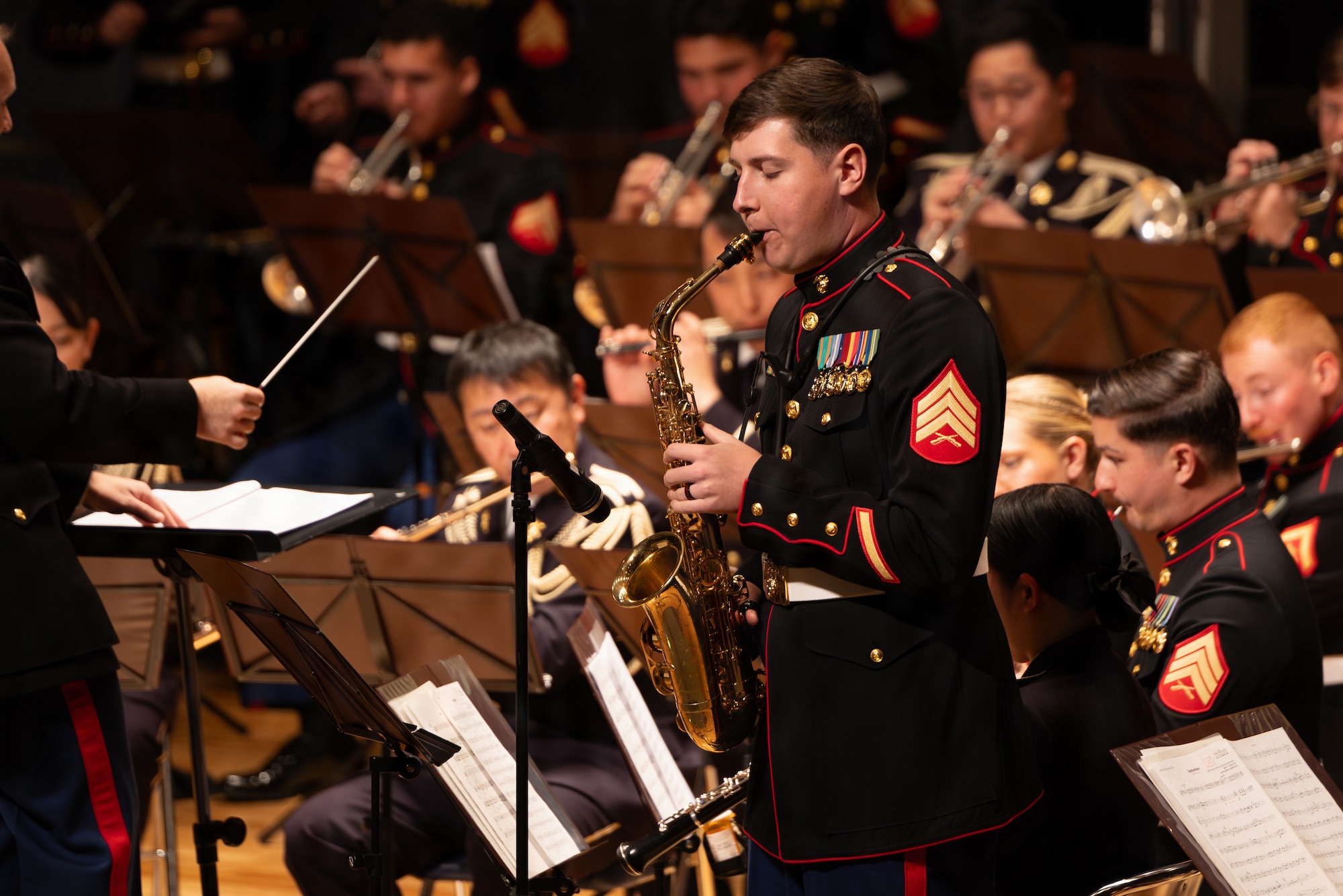 U.S. Marine Corps Sgt. Noah Lindsay, a saxophone instrumentalist with the III Marine Expeditionary Force Band, performs a solo during the Hamada Disaster Recovery Commemoration Day Concert, at the Shimane University Auditorium, Hamada, Shimane, Japan, Feb. 15, 2026. The event hosted by Hamada City, featured performances from the Japan Ground Self-Defense Force 13th Band and III MEF Band. The Marines performed alongside the attending bands to build and strengthen their relationships with the local community and their partners. Lindsay is a native of Oregon. (U.S. Marine Corps photo by Sgt. Nicholas A. Cox)
