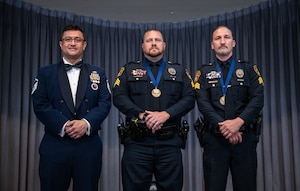 From left, U.S. Air Force Master Sgt. Ryan McConnell 42d Force Support Squadron Airman Leadership command, and Sgts. Adam Wright and Robert Hubbard, both with the Montgomery Police Department, pose for a photo during an ALS graduation at Maxwell Air Force Base, Alabama, May 21, 2026.