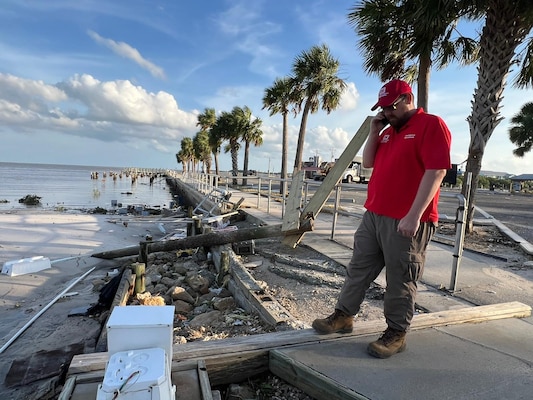 Jake Edwards, a liaison officer with the U.S. Army Corps of Engineers Jacksonville District, surveys hurricane damage from high water in Cedar Key, Fla. Sept. 28, 2024 following storm Hurricane Helene.USACE brings unique capabilities to emergency responses, but we are just one piece of a much larger Army and DOD team working to support our federal, state, and local partners. (USACE photo by Mark Rankin)
