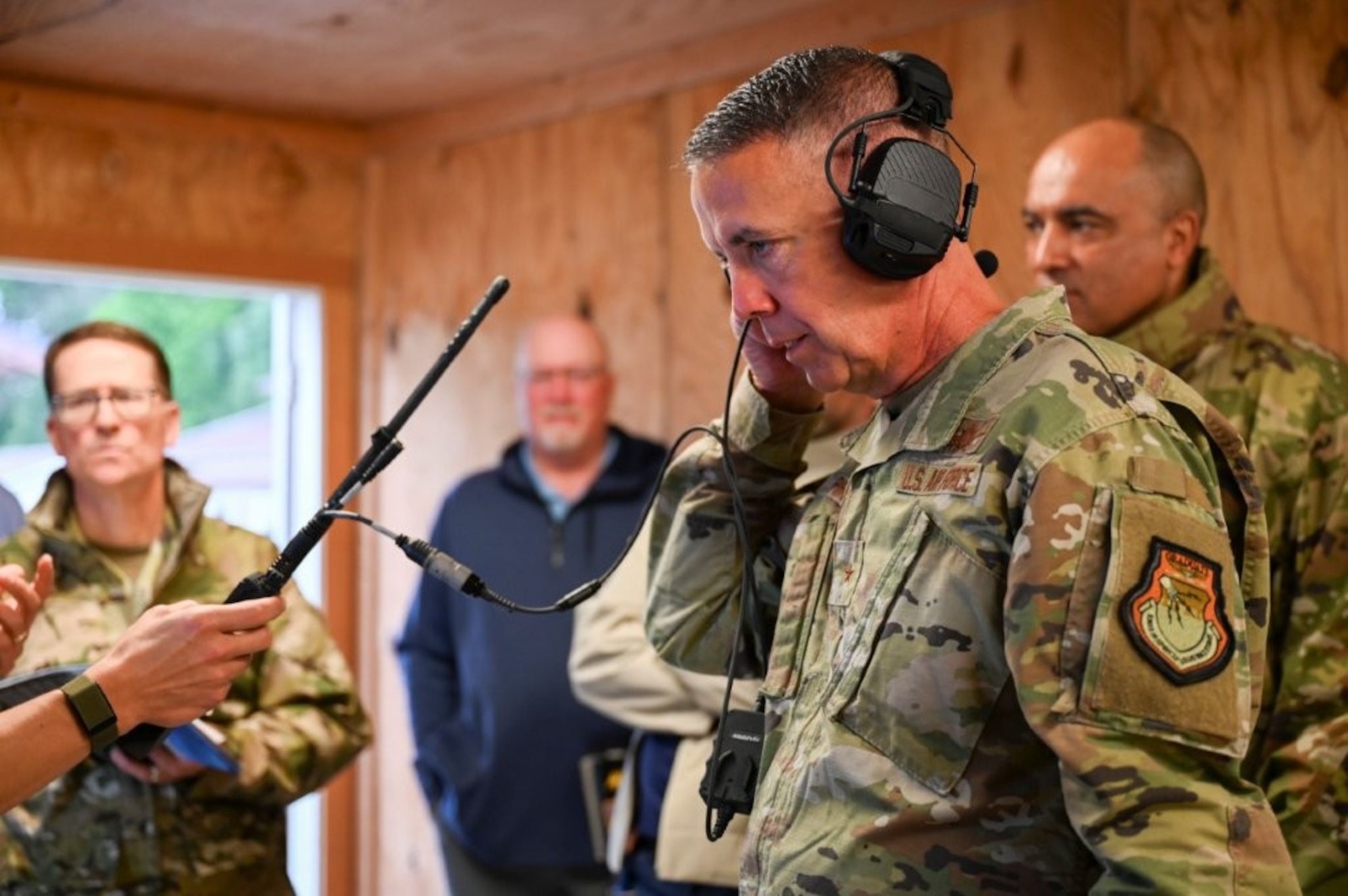 U.S. Air Force Brig. Gen. Jeffrey Phillips, Air Combat Command director of Cyberspace Operations and Warfighting Communications (ACC/A6), tests communication equipment during the Raptor Town Tactical Communications Demonstration at Joint Base Langley-Eustis, Virginia, May 7, 2026. The event provided an environment for leaders from across the Air Force to discuss innovative solution for deployable network kits.