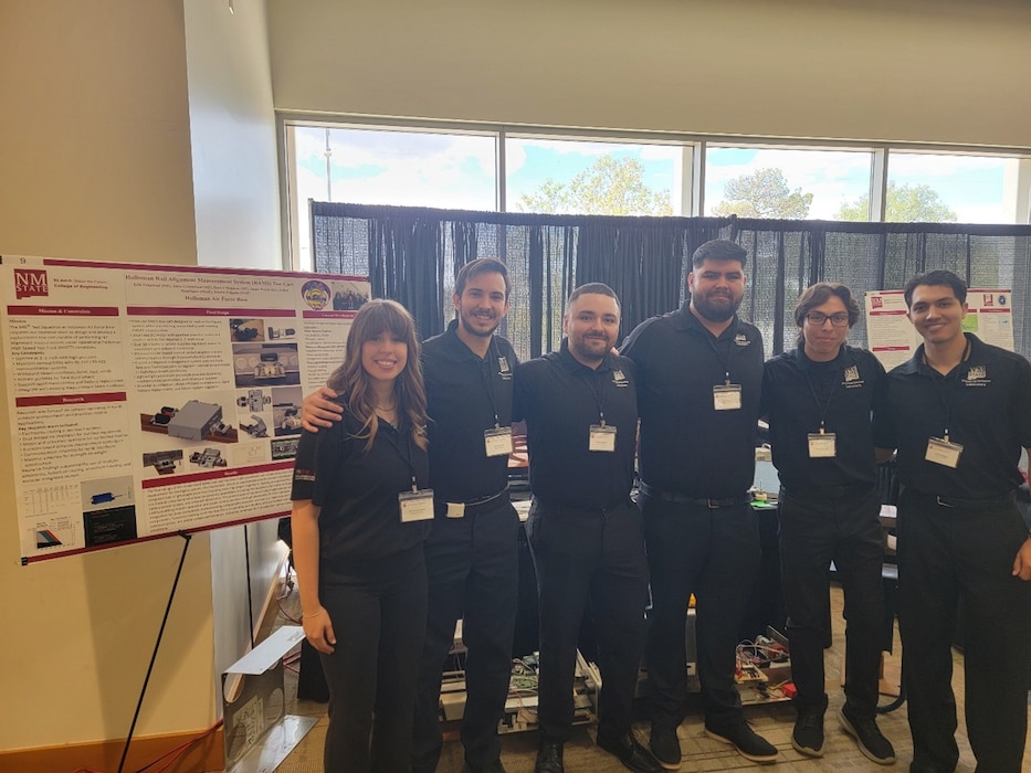 The team of New Mexico State University students who worked on a Capstone Design project proposed by the 846th Test Squadron gathers for a photo May 1, 2026, at NMSU. The university annually sponsors a Capstone Design Program through which commercial and government agencies can submit a project for students to work on throughout the school year. NMSU students who worked on the project pictured from left are Anna Greenwood, Erik Villareal, Daniel Mendoza, James Payan, Anibal Manriquesz and Jeindal Delgado. The 846 TS proposed the redesign of the Rail Alignment Measurement System cart it uses to properly align the rails of the Holloman High Speed Test Track. The 846 TS is a unit of the 704th Test Group at Holloman Air Force Base, New Mexico. The 704 TG is a unit of Arnold Engineering Development Complex, headquartered at Arnold Air Force Base, Tenn. (Courtesy photo)