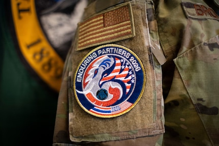 Senior Master Sgt. Naz Brockman, the State Partnership Program Senior Non-Commissioned Officer In Charge with the Washington Air National Guard, wears an Enduring Partners patch at Camp Murray, Wash., on June 1, 2026.
