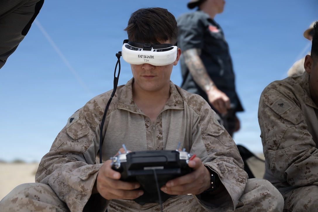 U.S. Marine Corps Cpl. Jose J. Lagunas, an Illinois native, small unmanned aircraft system specialist with 2nd Battalion, 7th Marine Regiment, 1st Marine Division, pilots a drone at Range 100, Marine Corps Air Ground Combat Center, Twentynine Palms, California, May 20, 2026. Through intensive hands-on training, the course equips service members with tactical first-person view piloting skills, directly enhancing lethality and survivability in contested environments, (U.S. Marine Corps photo by Pfc. Ethan DePaul)