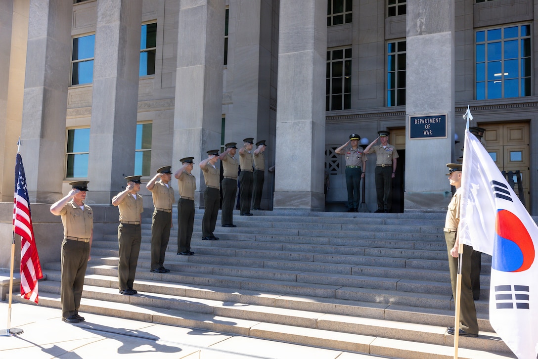 The 39th Commandant of the Marine Corps, Gen. Eric M. Smith, and the Commandant of the Republic of Korea Marine Corps, Lt. Gen Ju II-Seok, stand for colors during an honors cordon at Arlington, Virginia, June 2, 2026.. This event was held to render honors to Lt. Gen. Ju II-Suk. (U.S. Marine Corps photo by Lance Cpl. Aiyana Bridges)