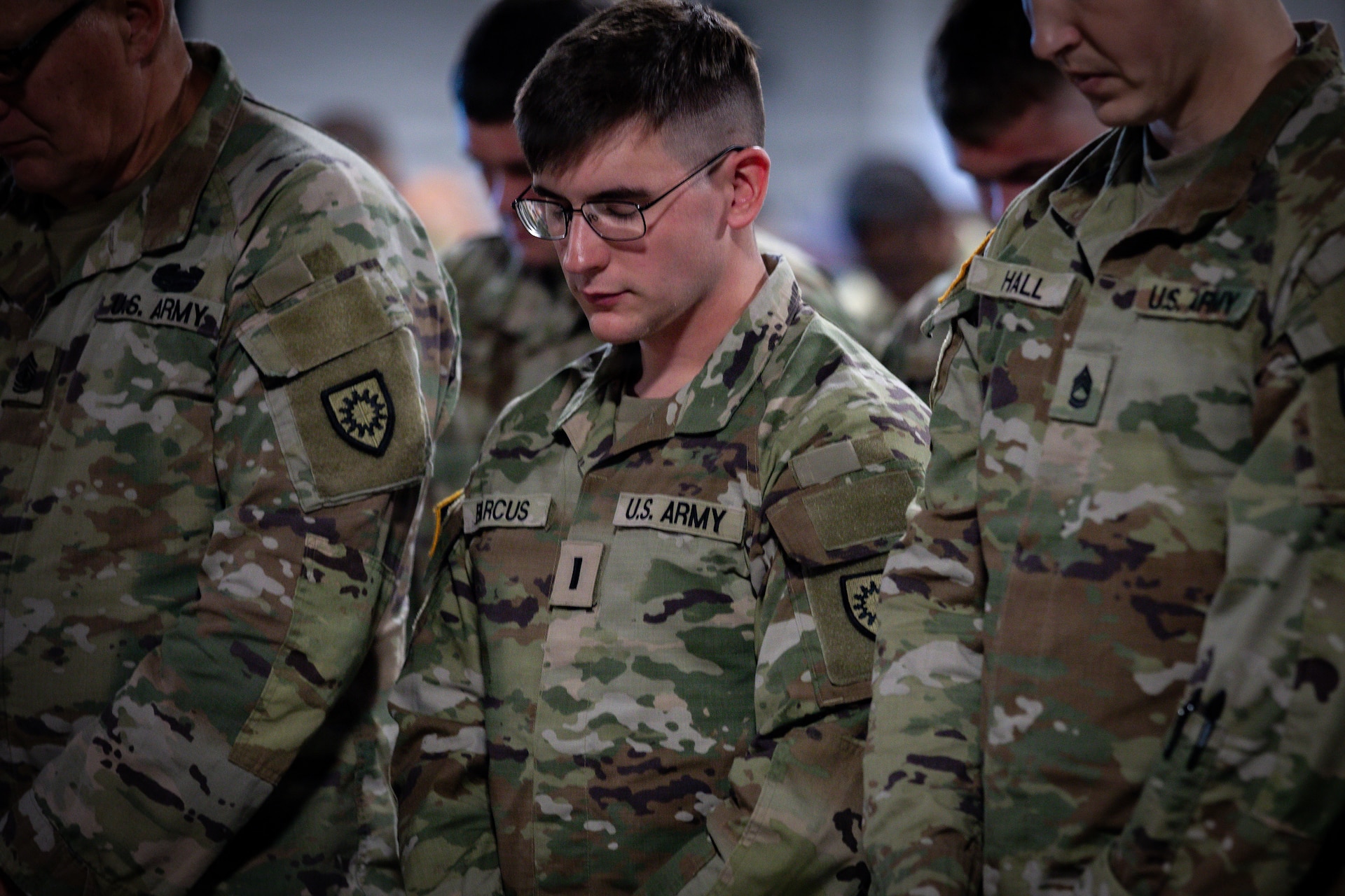 U.S. Army 1st Lt. Gabriel Barcus bows his head during the benediction of the departure ceremony for Kentucky's 201st Engineer Battalion, held at the Boyd County Community Center in Catlettsburg, Kentucky, May 30, 2026.