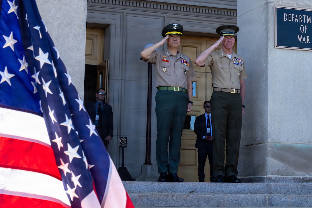 The 39th Commandant of the Marine Corps, Gen. Eric M. Smith, and the Commandant of the  Republic of Korea Marine Corps, Lt. Gen Ju II-Seok, stand for colors during an honors cordon at Arlington, Virginia, June 2, 2026.. This event was held to render honors to Lt. Gen. Ju II-Suk. (U.S. Marine Corps photo by Lance Cpl. Aiyana Bridges)
