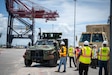 Cargo is loaded onto the Bob Hope-class roll-on, roll-off ship MV Roy P. Benavidez (T-AKR 306) during exercise TRANSMARINER-26 at the Port of Ponce, Puerto Rico, May 12, 2026. The cargo was transported as part of U.S. Transportation Command’s exercise Turbo Distribution, destined for the Port of Gulfport, Mississippi. (U.S. Army photo by Christopher Parr)