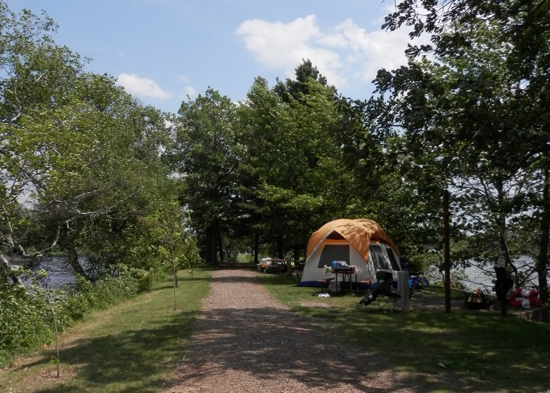 A scenic primitive campsite with a tent.