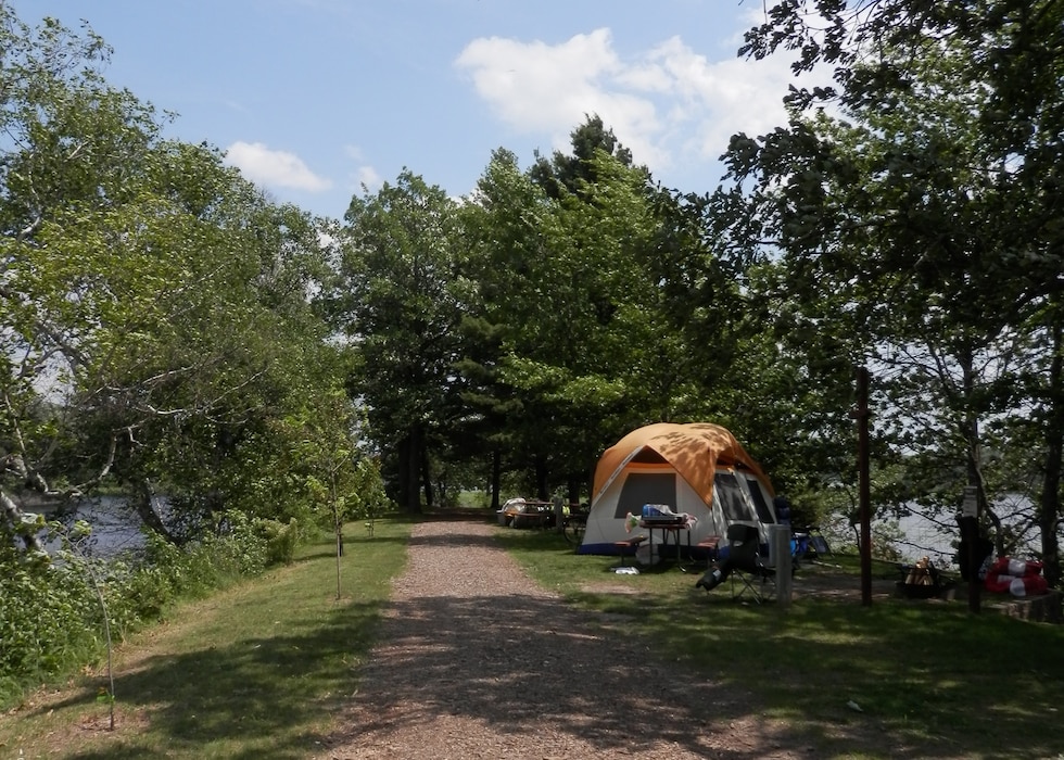A scenic primitive campsite with a tent.