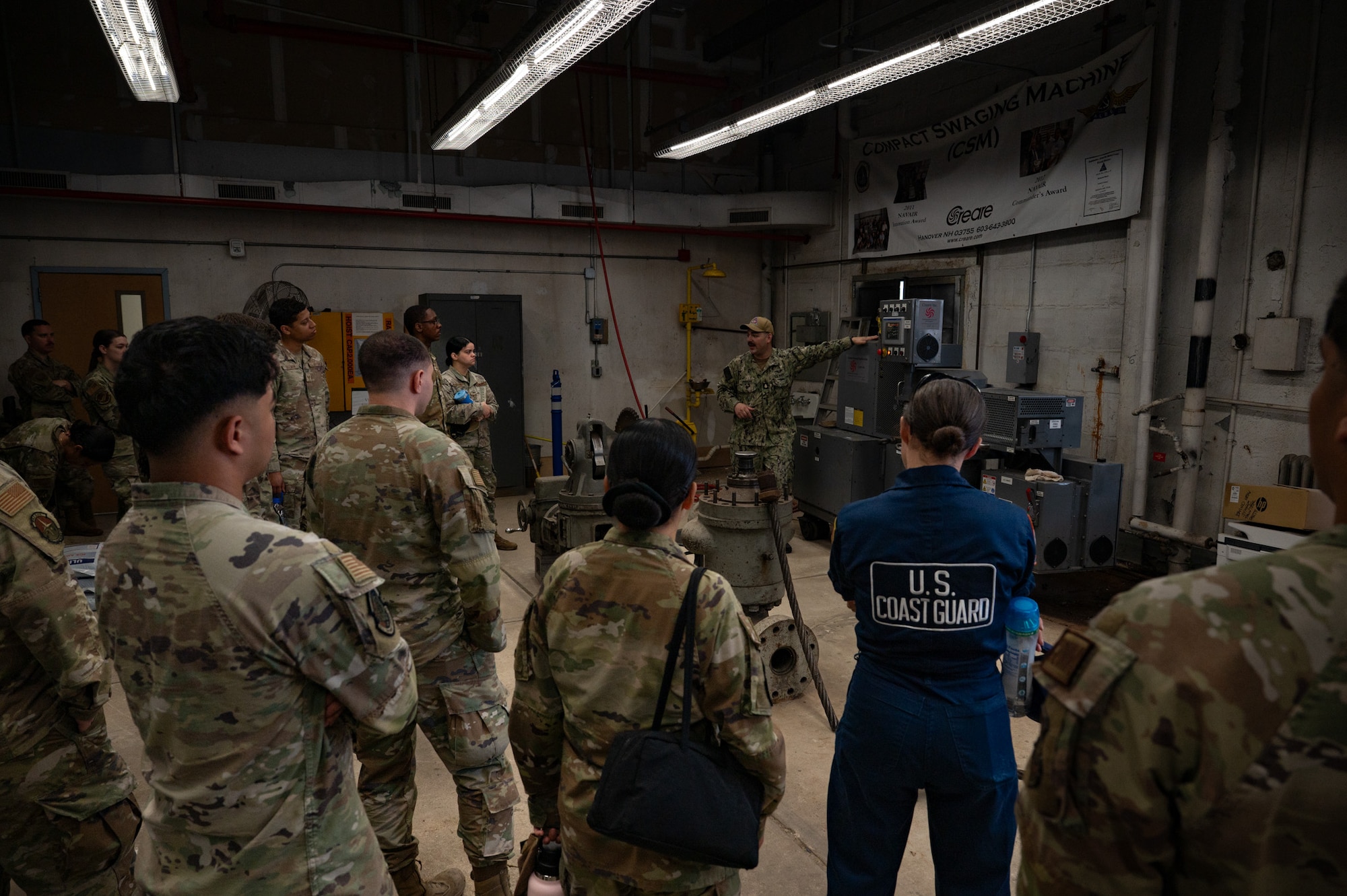 U.S. Navy Aviation Boatswain Mate Equipment Chief John Pintore, Naval Air Technical Training Center Detachment Lakehurst leading chief petty officer, walks service members through launching and recovering aircraft as part of the Leading Edge course at Joint Base McGuire-Dix-Lakehurst, N.J., May 20, 2026. The tour gave service members the opportunity to learn the Navy’s capabilities for launching and recovering aircraft. (U.S. Air Force photo by Airman 1st Class Haeleigh Bayle)