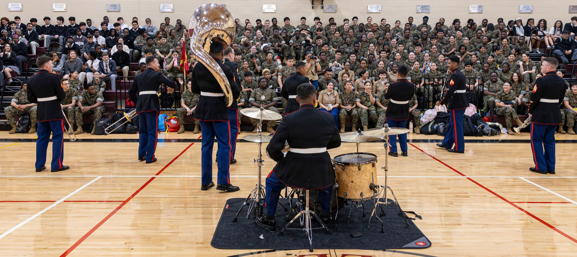 U.S. Marines with the Marine Forces Reserve Brass Band perform for students at Margaret Long Wisdom High School in Houston, Texas, March 3, 2026. The performance was in conjunction with school visits to engage with students and highlight career opportunities in the Marine Corps band. (U.S. Marine Corps photo by Cpl. Christian Salazar)